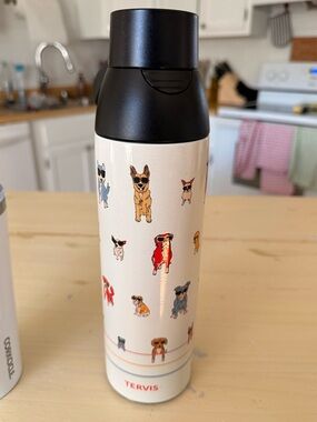 tervis Cream Travel Tumbler with Colorful Dog Illustrations and Black Lid